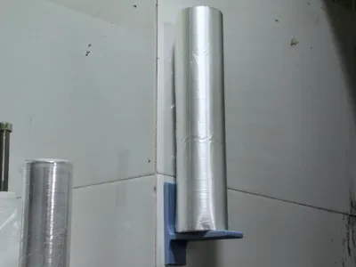 Cling film and plastic wrap dispenser