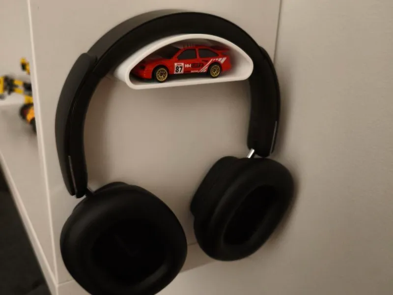 Headphone holder with extra storage compartment