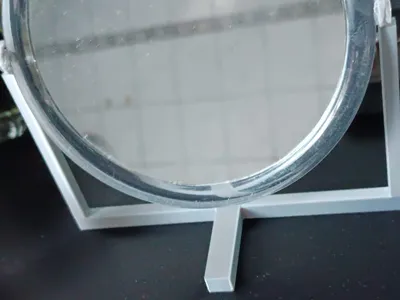 Mirror holder for rotating makeup mirror