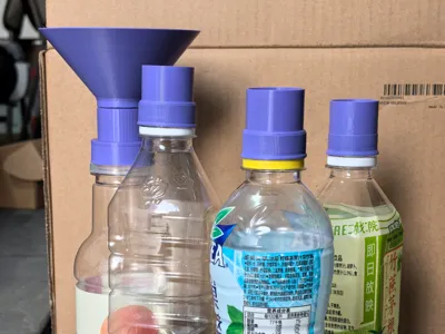 Interchangeable head bottle funnel