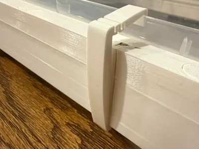 Spring-loaded U1 Cover Bin Clip