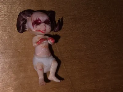 Child of Satan (replacement for Baby Jesus in a nativity scene)