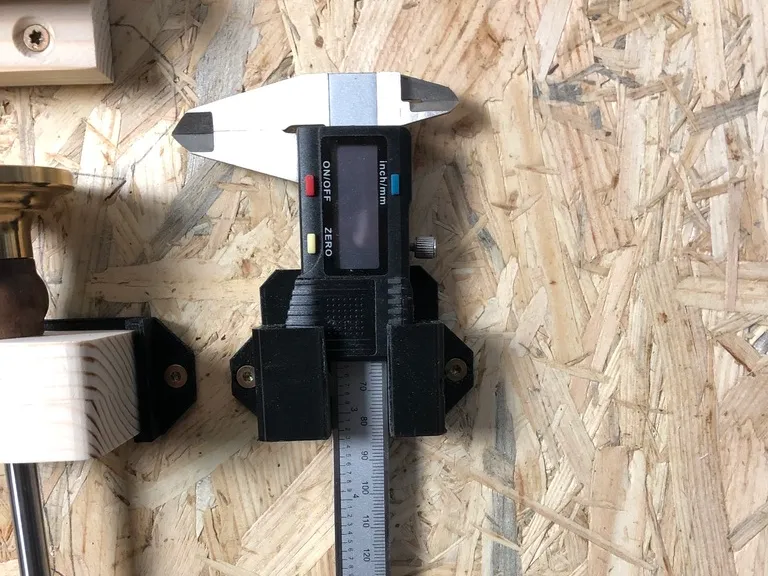 Holder for digital calipers with screw holes