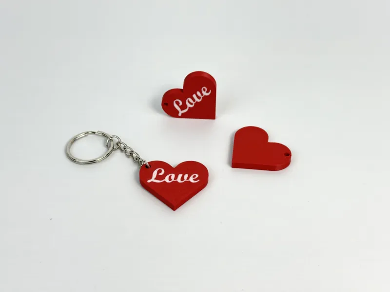 Heart keychain with "Love" inscription.