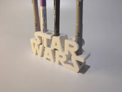 Pencil holder with superhero logos.