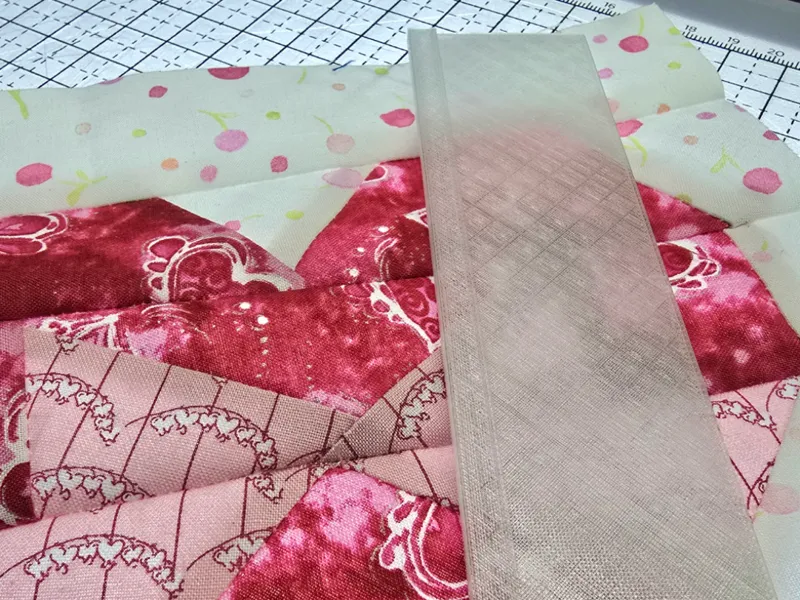Add-a-quarter ruler for paper piecing