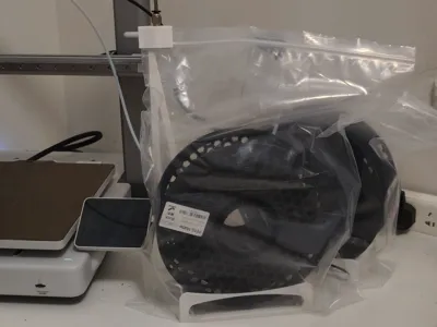 Low-cost filament holder & sealed printing solution
