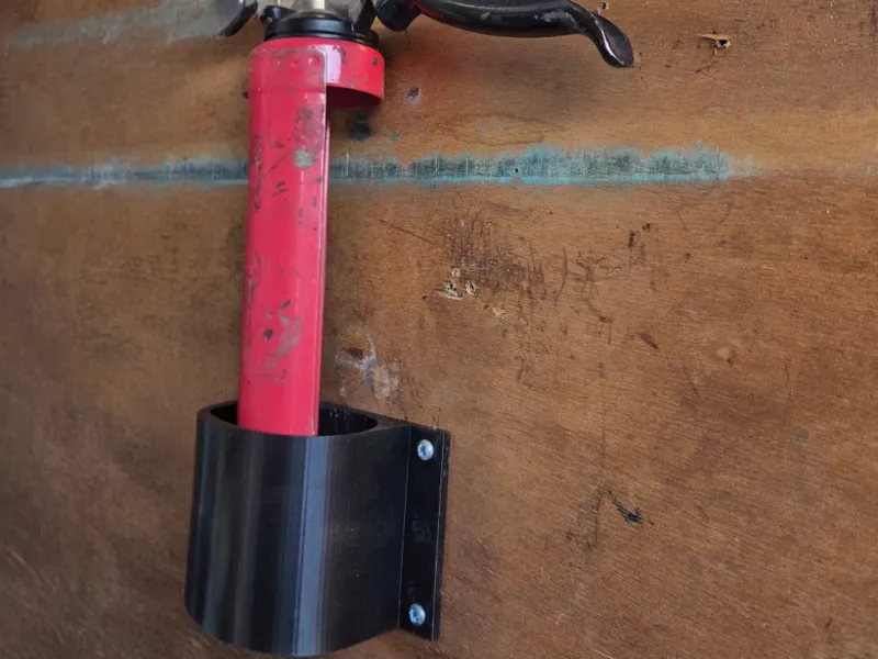 Caulk gun wall mount