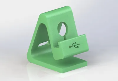Phone stand with reversible charge cable