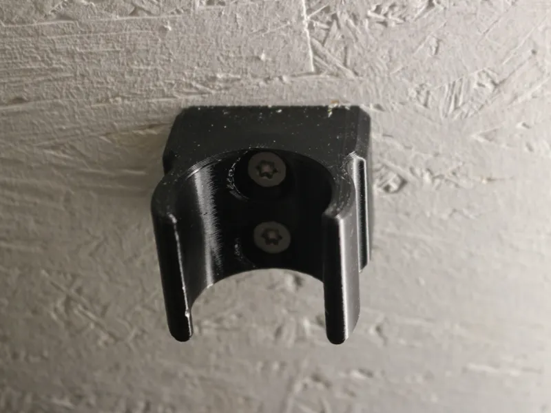 Wandhalter für eine Staubsauger-Düse