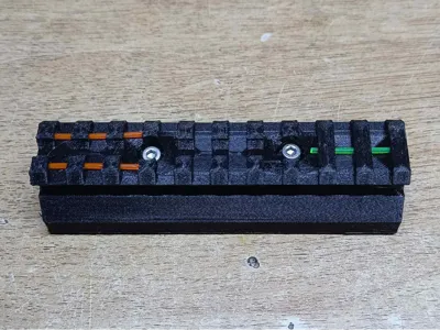 Picatinny Rail with integrated reflex sight