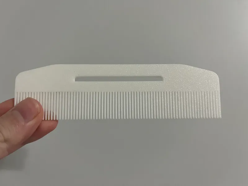 Hairbrush toothpaste squeezer