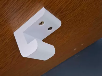 bracket for bucket under table