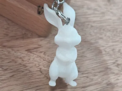Rabbit holding a lily