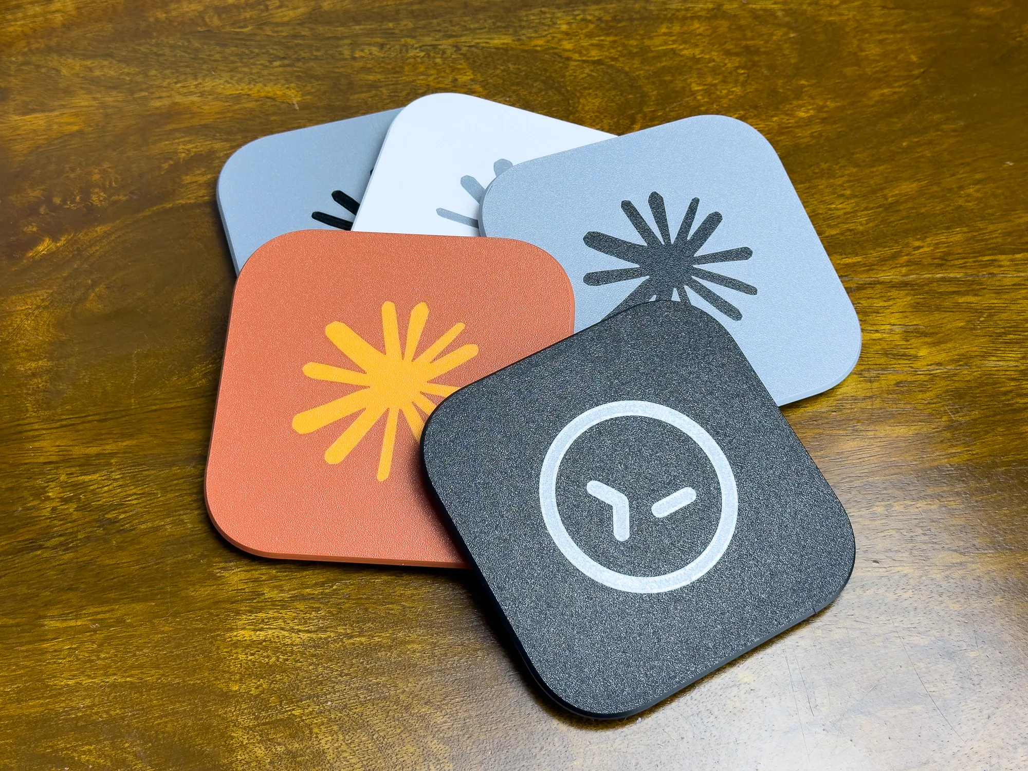 The photo shows multiple different top covers in different colors and with different logos on them.