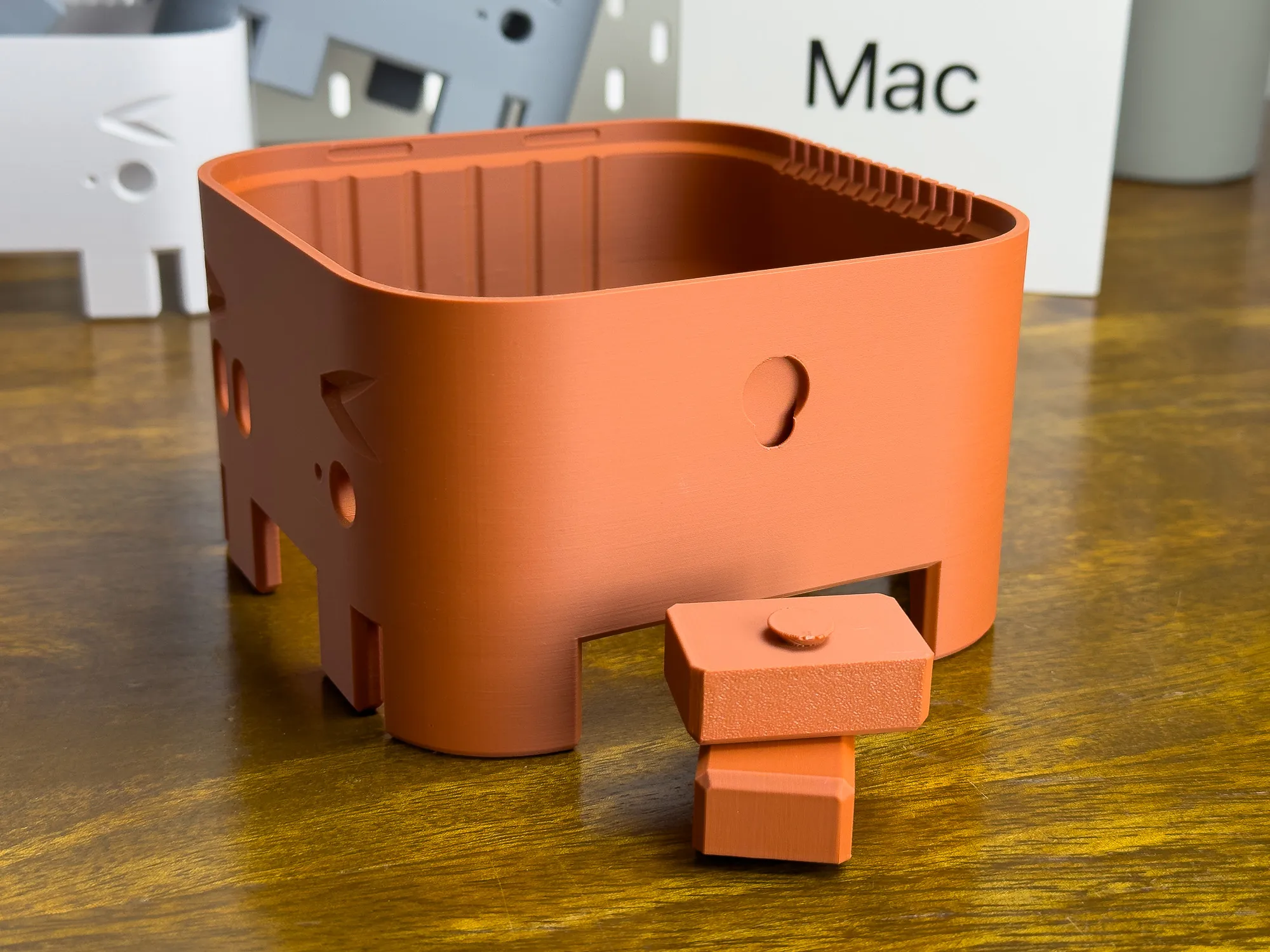 A close-up photo showing the snap socket for the claws/arms on the sides of the body.