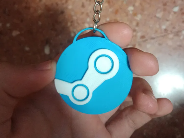 Llavero del logo de "Steam".