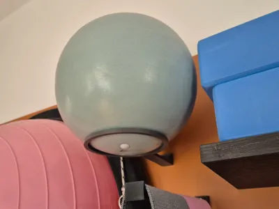 Small pilates ball wall holder