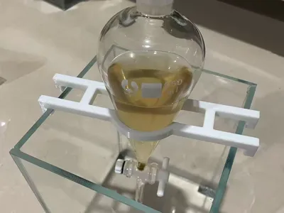 Separatory funnel or other filtering funnel clamp for home fish tanks or deep basins