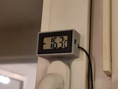 Electronic thermometer on a window handle