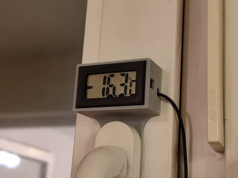 Electronic thermometer on a window handle