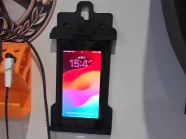 Wall phone holder