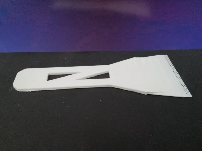 Printer bed scraper