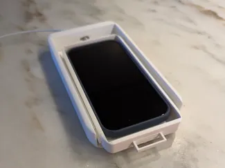 Under desk phone storage and charger