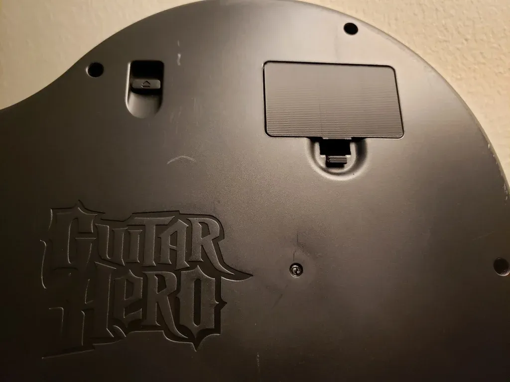 Cache-piles manette Guitar Hero PS3
