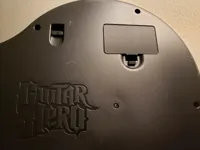 Cache-piles manette Guitar Hero PS3 — photo 1