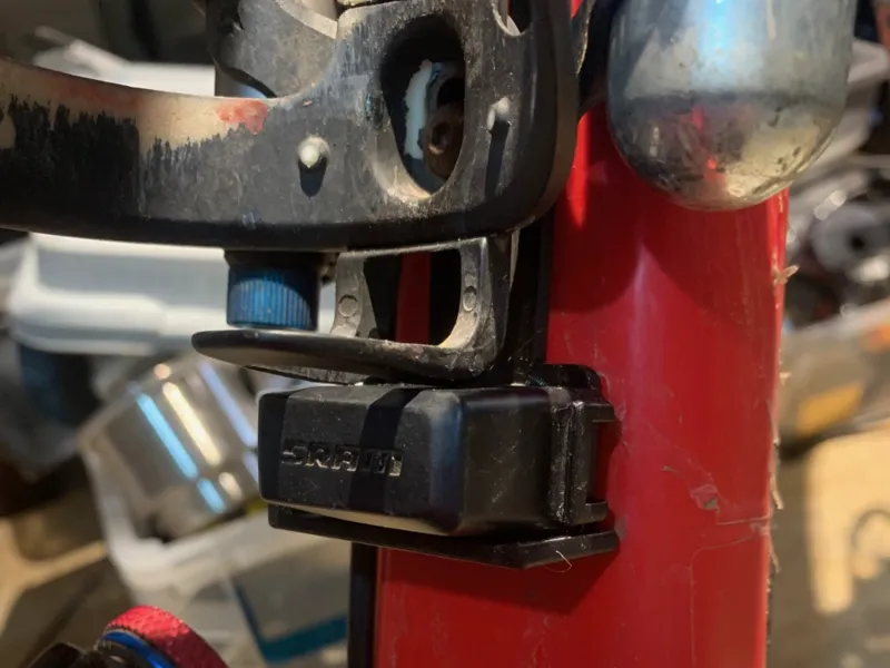 Armored SRAM AXS under water bottle battery holder