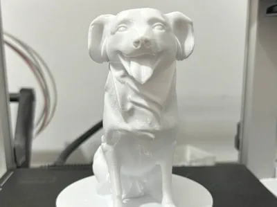 Dog sculpture with base