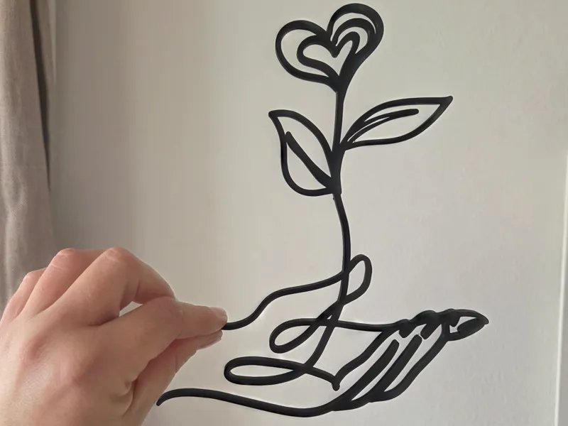 "Elegant One-Line Art - Hand holding Heart Flower"