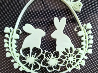Two bunnies with a butterfly
