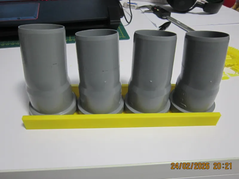 holder for sewer elbows
