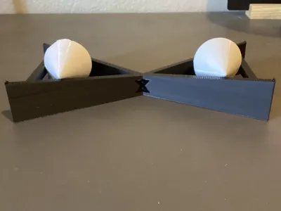 Gravity Defying Rolling Upwards Double-Ramp