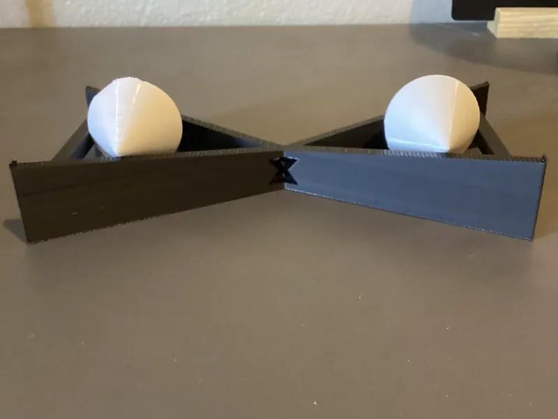 Gravity Defying Rolling Upwards Double-Ramp