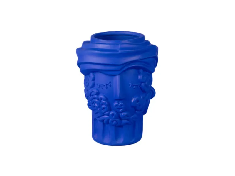 Blue ceramic vase with face and floral