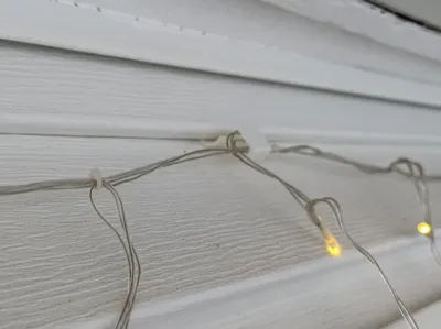 Vinyl siding light clip