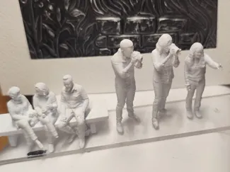 Figures of sitting people