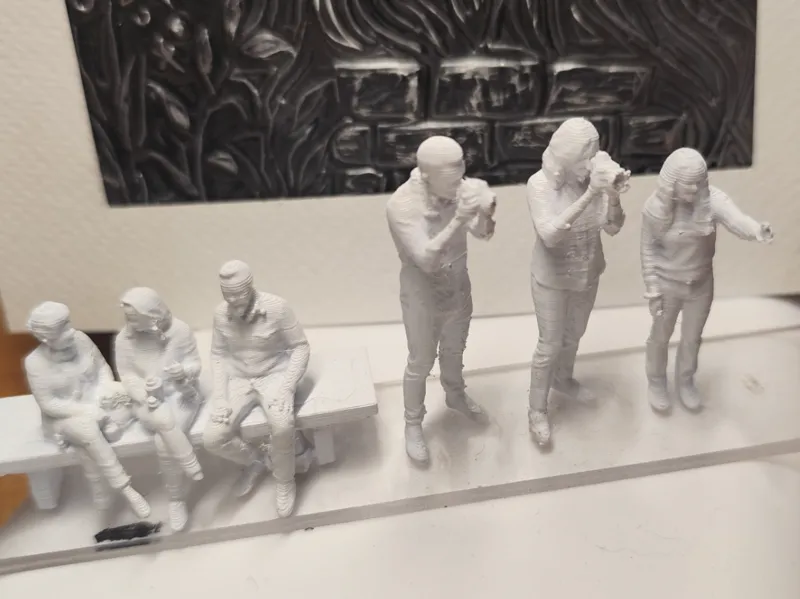 Figures of sitting people