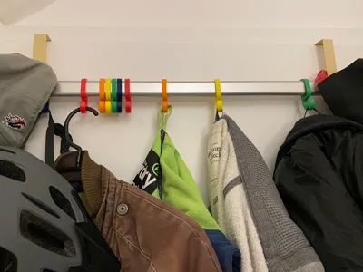 Hooks for clothes rail