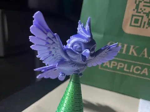 flying cockatiel with base
