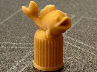 Valve cap with fish