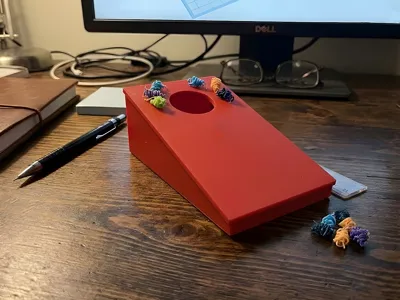 Cornhole game with filament waste 