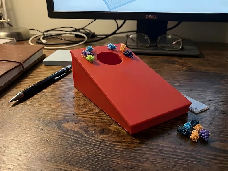 Cornhole game with filament waste 