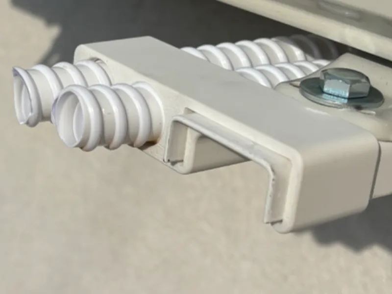 Air conditioner condensation hose holder 