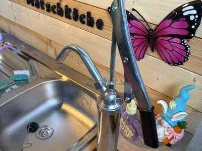 Attachment for Oil Barrel Pump on Mud Kitchen