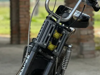Piaggio Bravo headlight bracket