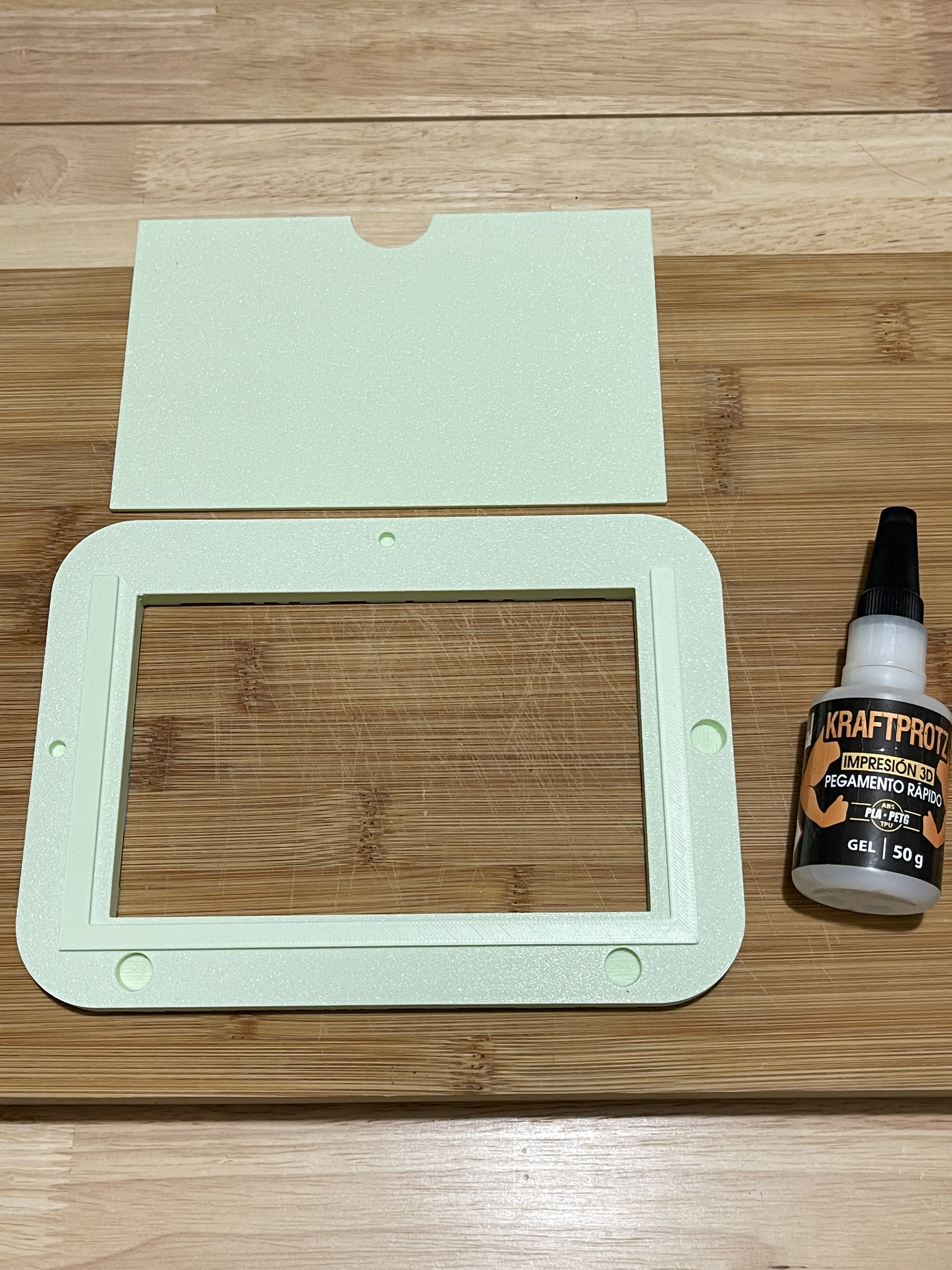 Place the central part inside the frame, leaving small margins on the sides and bottom. Apply glue to secure it.